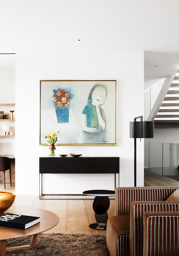 Minotti ‘Divo’ side table in black nickel. A Charles Blackman artwork hangs above the console.