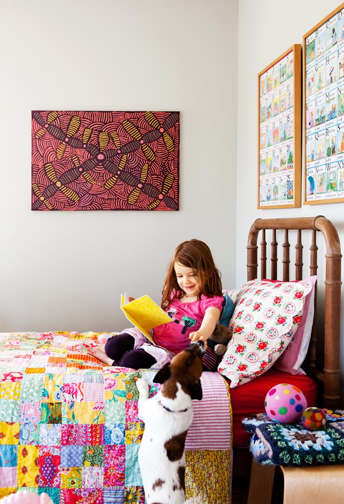 Jane’s daughter and the family’s Jack Russell share a moment in her colourful bedroom.