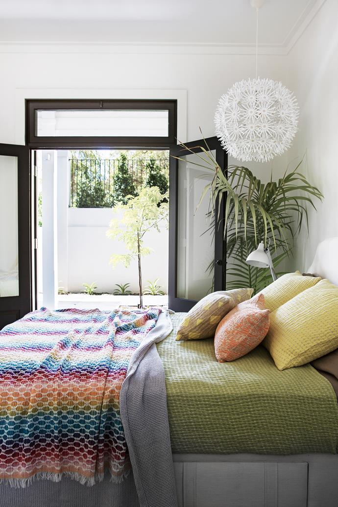 Potted palms and courtyard access give this bedroom an open, airy feel. Bedcover and cushions, [Busatti Perth](http://www.busattiperth.com.au/?utm_campaign=supplier/|target="_blank"). Missoni throw, [Empire Highgate](http://www.worldofempire.com/?utm_campaign=supplier/|target="_blank"). Smart buy: Maskros pendant light, from $69, [Ikea](http://www.ikea.com.au/?utm_campaign=supplier/|target="_blank").