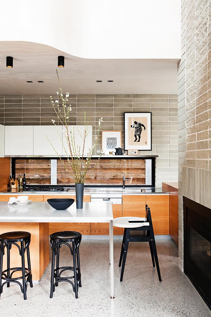 Rather than overpowering the room with a big island bench, a marble top sits on sleek stainless steel-frame. Take a tour of this [environmentally-conscious new build](http://www.homestolove.com.au/how-to-build-an-eco-friendly-family-home-from-scratch-3490|target="_blank").
