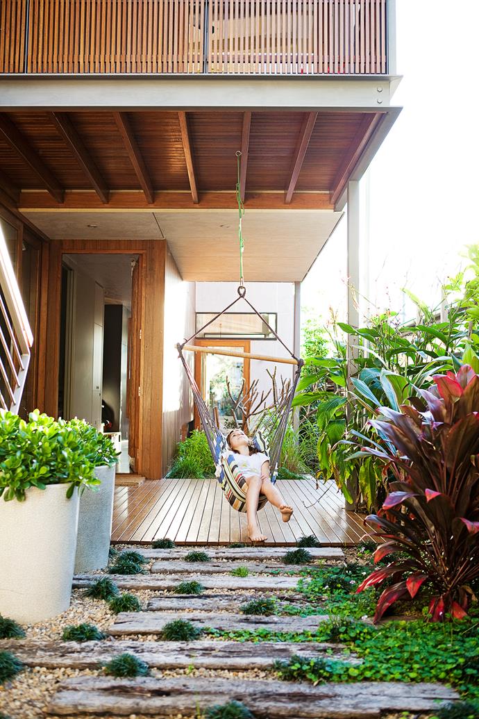 Nina loves to play in the swing located by the front door. The surrounding greenery is lush and includes a herb garden and a privacy screen planted by the neighbours.