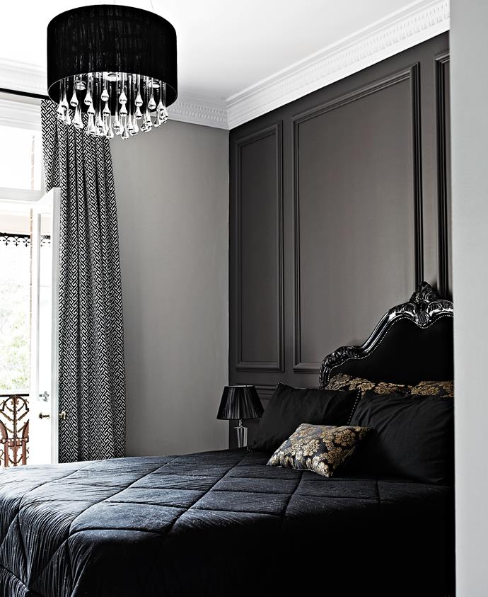 Dark panelled wall injects the space with a classic, moody luxe vibe.