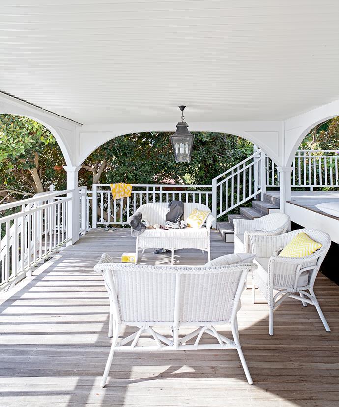 **Laid-back living.** Wicker has become synonymous with Hamptons style. It is, more often than not, painted white to reflect light and keep the homes looking more beachy than country. This space, sheltered from the elements, is one of the homeowner's favourite spaces. "We love the tiered deck area, which was our only structural addition, and how much of the house opens seamlessly onto it," Jane says.