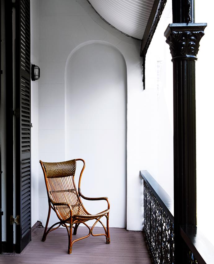 Colonial-style cane chair on the verandah.
