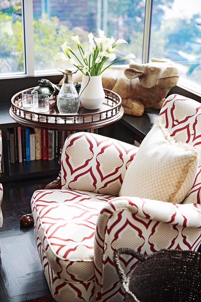 A vintage chair makes a comfy reading spot in the reclaimed balcony space. "It faces north-west and attracts a lot of natural light," says Alex, who designed the interiors.