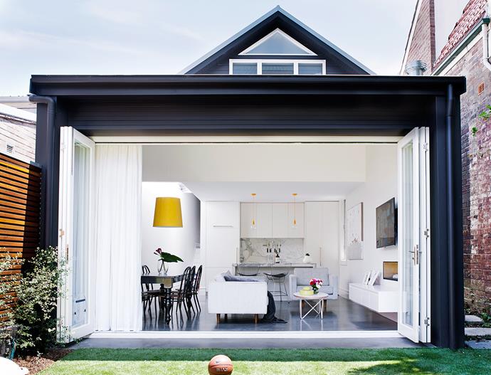 The back of the house was converted into an open-plan kitchen and combined living/dining room. Here, bifold doors were installed to increase the sense of space.
