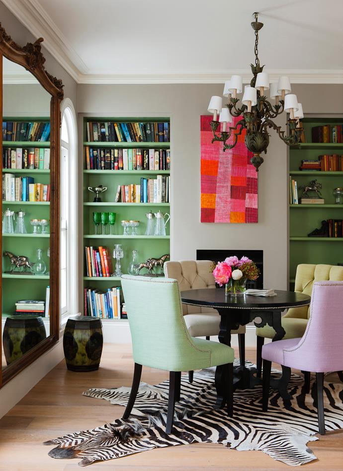 "I love the chairs around the dining table, all in the same gelato colour palette but different hues," says interior designer Charlotte O’Neil. Artwork by Regina Pilawuk Wilson.