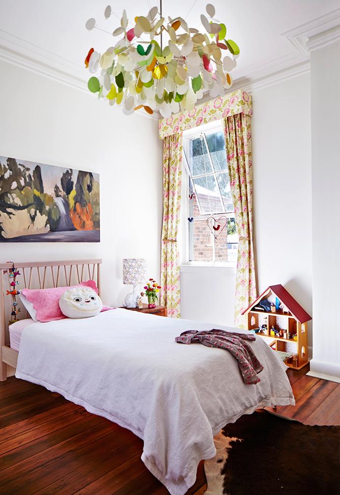 White walls provide a perfect canvas for pretty artworks and floral curtains. "We love to acquire new art and will always make space for another drawing, painting or etching," says Belinda