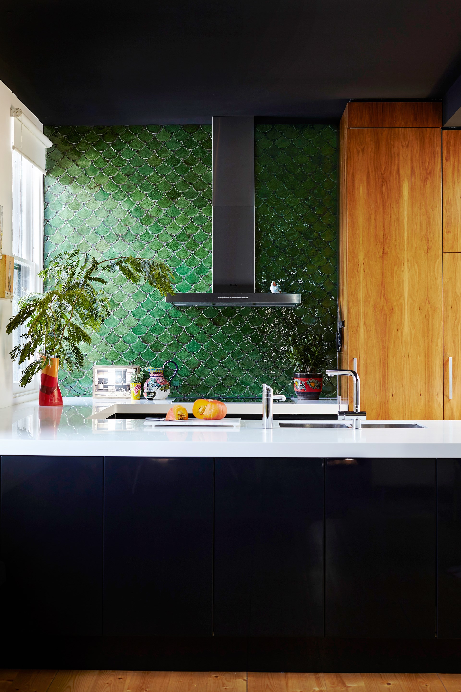 Olive-green fishscale-patterned tiles add character to the contemporary kitchen in this [Victorian home](http://www.homestolove.com.au/grand-victorian-home-gets-a-colourful-personality-3642|target="_blank"). Photo: Alicia Taylor