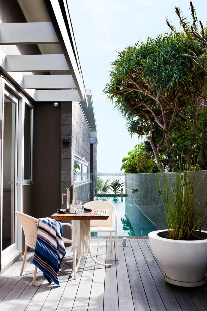 One bedroom opens onto a deck, the perfect place for drying out after a swim. The planter was found at a garage sale.