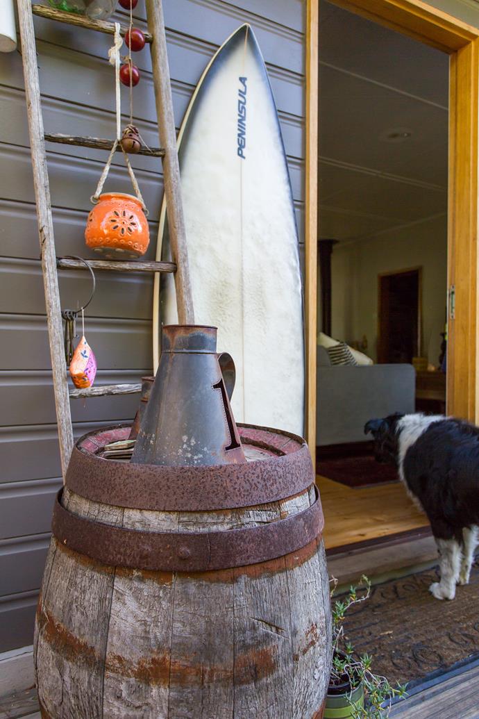 Judy loves to repurpose items, like this family heirloom ladder and an old wine barrel.
