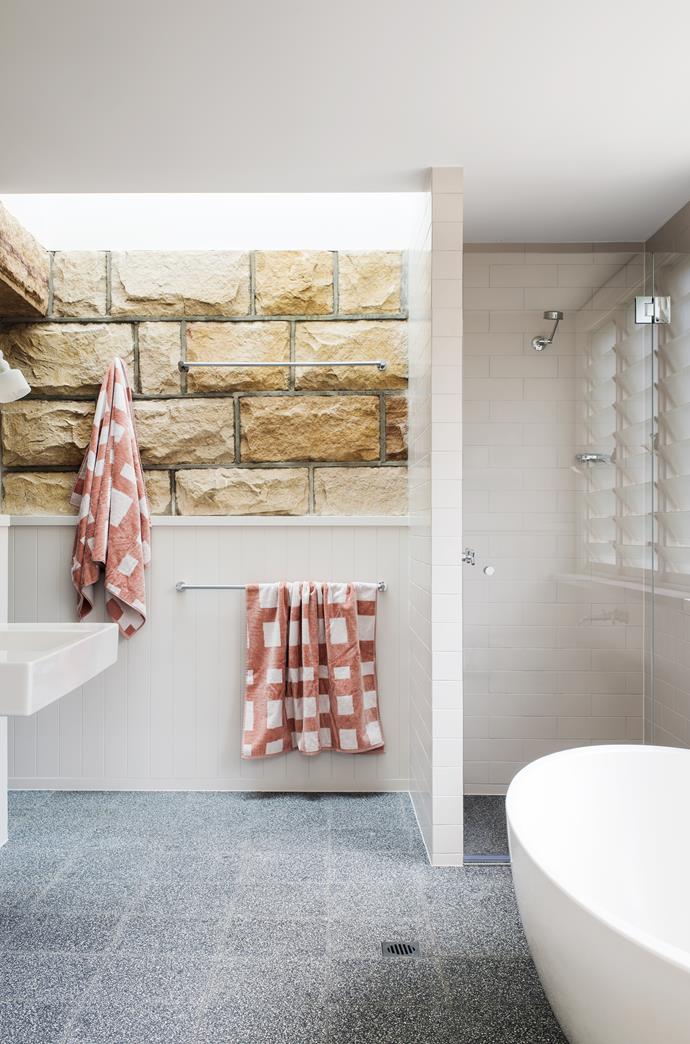A ground-floor balcony was enclosed with new sandstone to create a bathroom and laundry.