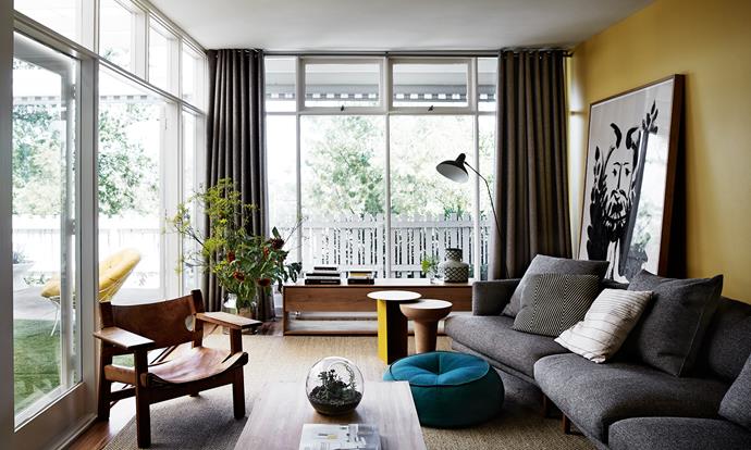Vivid hues, mostly sunny yellow and cerulean, feature throughout the home. A plump sofa is positioned to take advantage of the leafy view. The timber [coffee table](http://www.homestolove.com.au/coffee-tables-3192/?utm_campaign=supplier/|target="_blank") and low console are from Stephanie’s homewares shop [Open Room](http://www.openroom.com.au/?utm_campaign=supplier/|target="_blank").