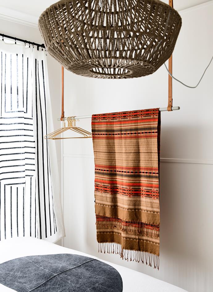This woven rope pendant is the hero of the room, while a [Kate & Kate](https://kateandkate.com.au/?utm_campaign=supplier/|target="_blank") linen throw is made into curtains.