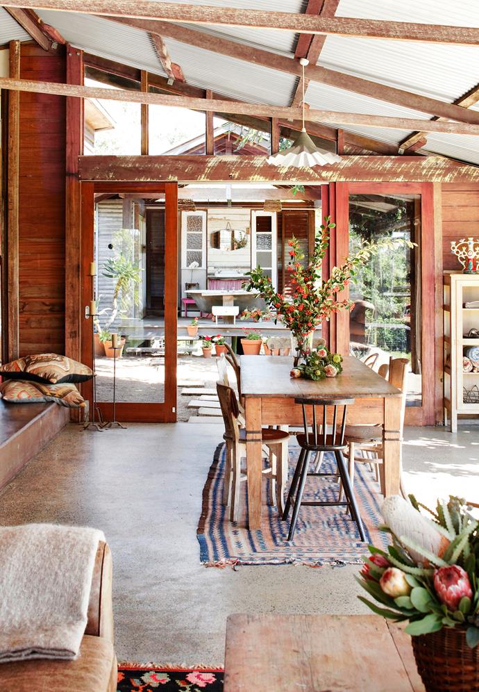 Though Sarah and Andrew (director of Hillhouse Architecture) had only been dating for two months when she laid eyes on a [dilapidated outbuilding](https://www.homestolove.com.au/a-cow-shed-conversion-in-queensland-3855|target="_blank") on Andrew's 2 hectare property, he knew she was right when she saw its potential. Though first deep within a meadow of noxious weeds, riddled with not one but two species of white ants, and sitting under a peeling, rusted roof, the gorgeously converted space now serves as their home.