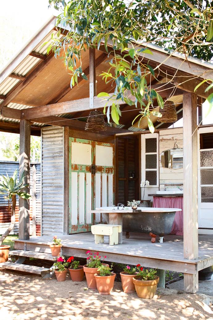 This separate bath house was constructed from recycled materials and new timber.