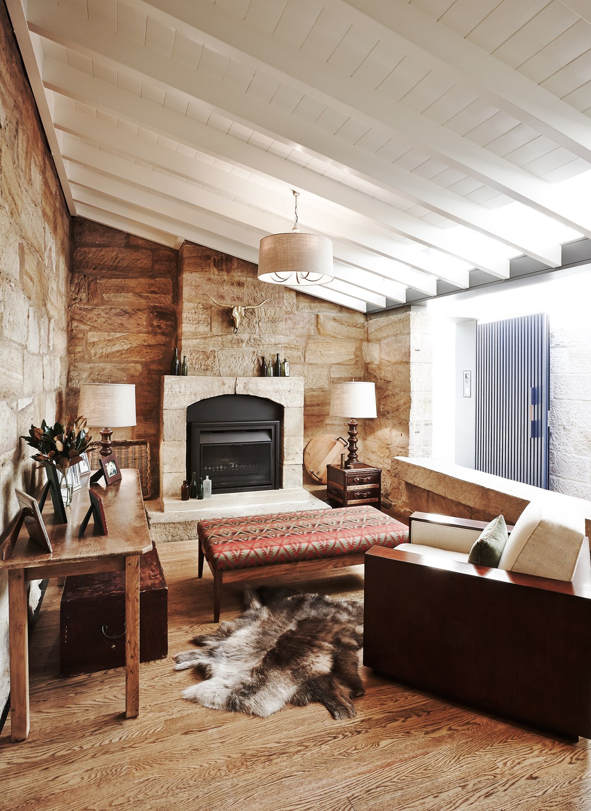 The original pink-coloured Hunters Hill sandstone was preserved and celebrated in the fireplace of [this heritage cottage,](https://www.homestolove.com.au/heritage-cottage-with-a-modern-extension-3879|target="_blank") which now sports a striking modern addition at the rear.