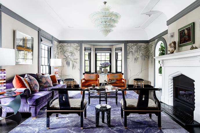 This luxe living room makes a statement with a royal purple and bold orange colour scheme. The plump seating and a lush rug  are fit for a king. Take a tour of the [grand neo-Georgian style home](http://www.homestolove.com.au/radically-elegant-restoration-of-1930s-home-3891/?utm_campaign=supplier/|target="_blank"). *Photo: Maree Homer*