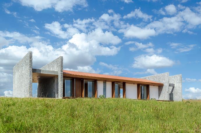 **House ER - Padre Bernardo, Goiás**
This rustic country home by [Estudio MRGB](http://www.mrgb.com.br/|target="_blank") was eight years in the making. Featuring only two bedrooms, a bathroom and an open-plan living/dining/kitchen area, this peculiar house encapsulates the essence of simple country living. Photo: Estudio MRGB.