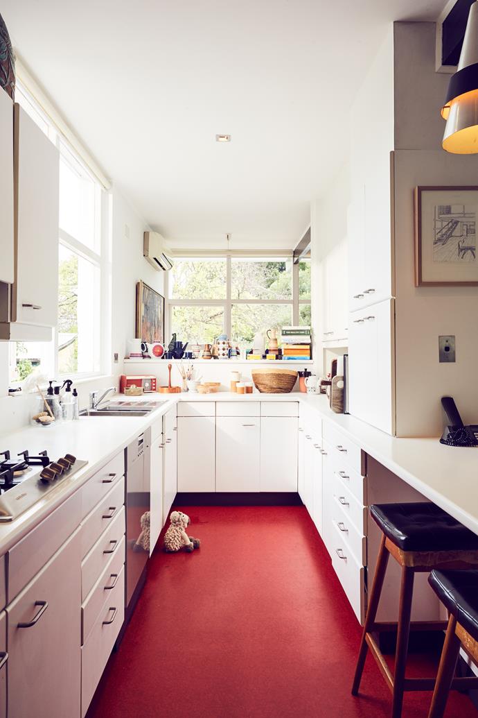 Previous owners renovated the kitchen in the 1960s, so the only change Tim made was to replace the cupboard door handles. Visitors tend to congregate in the kitchen. "It's quite funny because it's not a big area, but it just naturally happens," Michelle says.