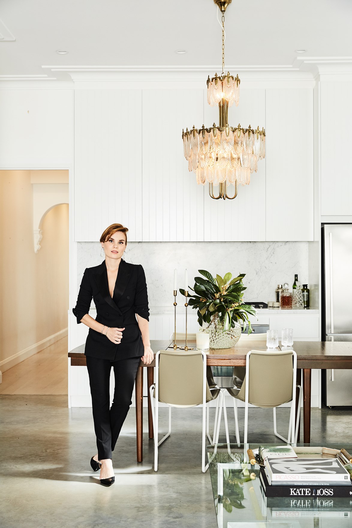 As a fashion stylist, it's only natural that Tanya Levak has an eye for decorating, too. Her [chic inner-city abode](https://www.homestolove.com.au/a-fashionable-cottage-renovation-in-sydney-4053|target="_blank"), reflects her eye for detail and luxurious finishes. A Japanese Art Deco chandelier from The Bronte Tram in Sydney acts like a statement pair of earrings and creates a focal point of the dining area. *Photo:* Sylvè Colless