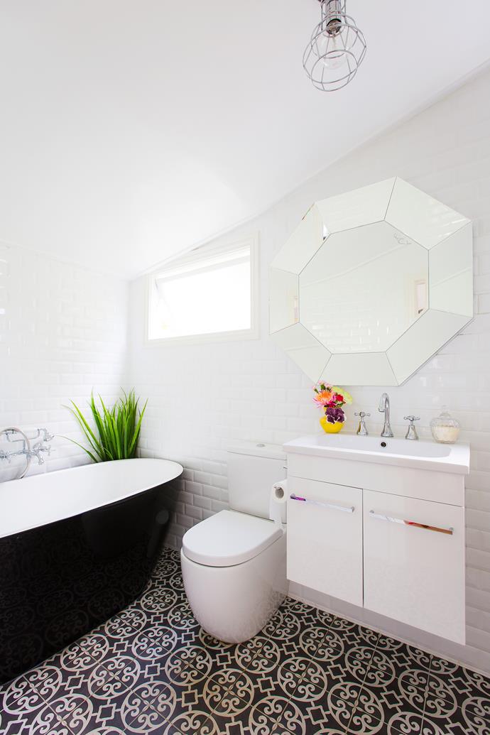 The renovated bathroom stays true to the home's old-time character whilst adding a refreshing modern touch.