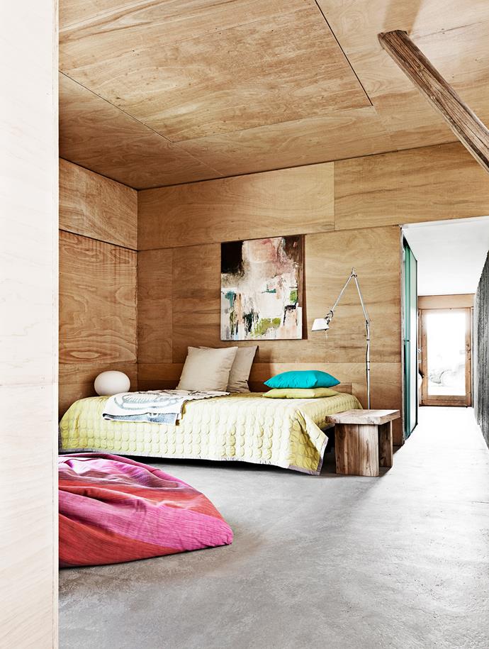 Plywood lines the walls and ceilings, which works well here due to the room's grand proportions.