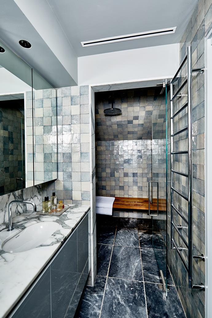Carrarra marble and handmade tiles from [OnSite](http://onsitesupply.com/|target="_blank") create a stylish statement in the shower and Viking steam room.