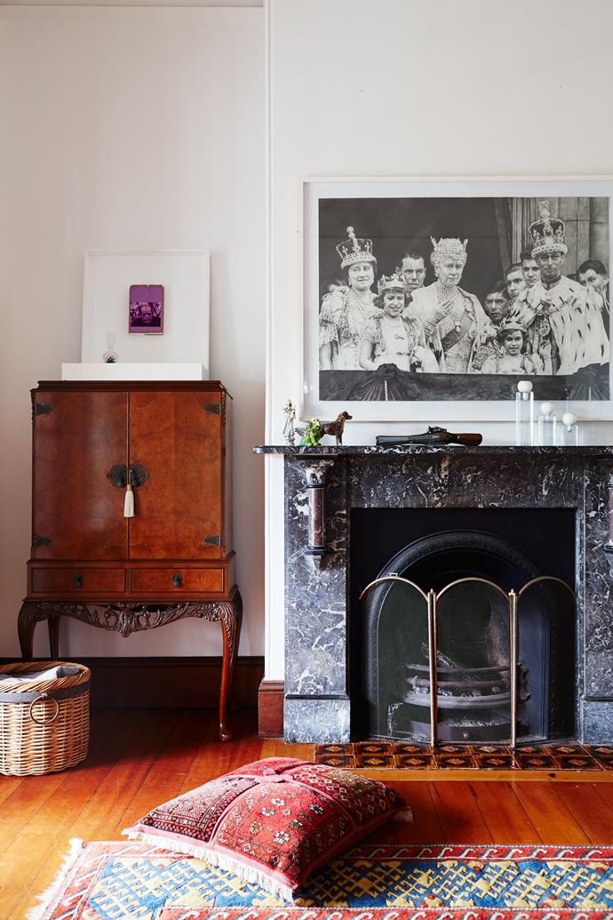 Antique Liberty of London drinks cabinet sits seamlessly next to the existing fireplace. Paintings by Chris Bond (above cabinet) and Sam Cranstoun (above mantel).