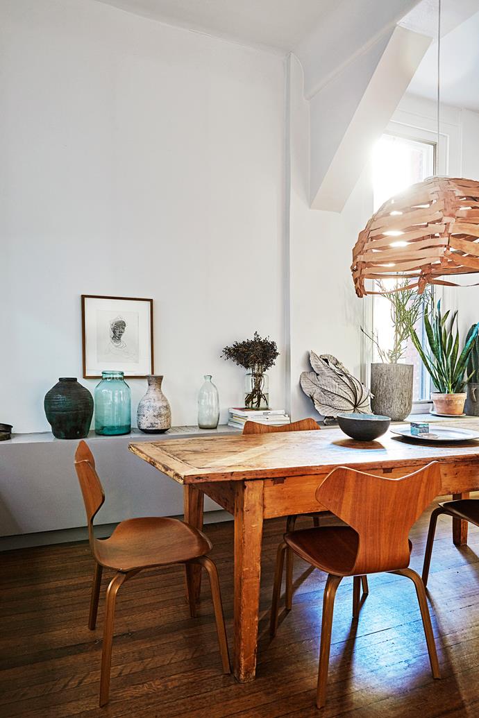 The vintage dining table was the first piece of furniture Kirsten bought when she moved to New York. It is teamed with green Grand Prix chairs by Arne Jacobsen. The leather pendant was custom-made by New York designer Jennifer Stilwell, who is more known for designing bags.
