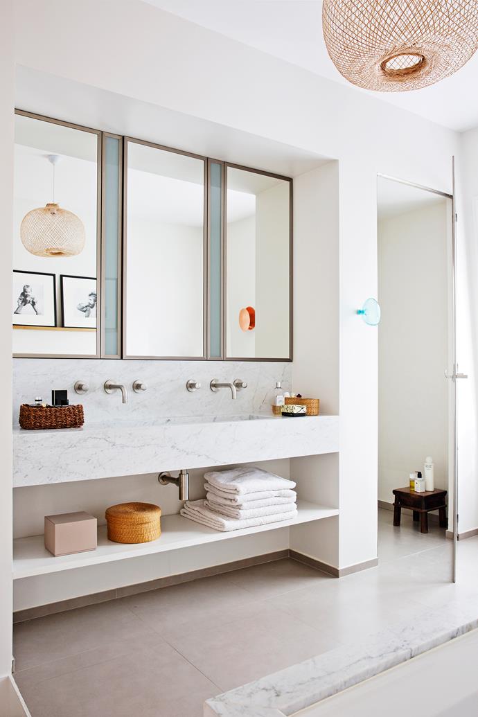 Once a living room, the bathroom enjoys the luxury of space – and Carrara marble (on the vanity and bath). Despite the opulent materials, it’s actually simple in design to suit the nearby bedrooms.