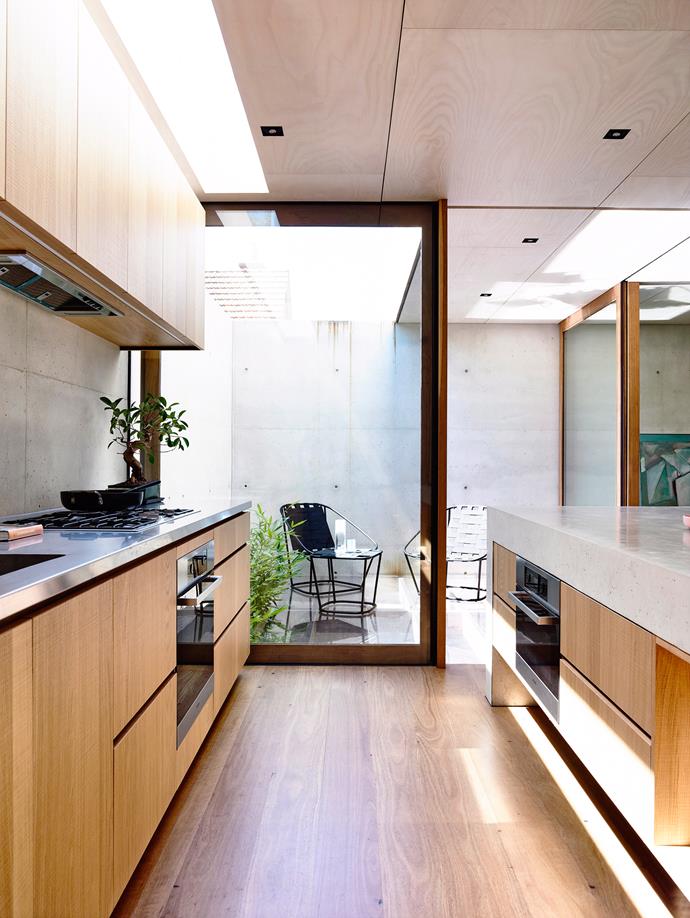 An integrated oven allows for a sleek kitchen profile, where stunning joinery steals the show. *Photo: Derek Swalwell / bauersyndication.com.au*