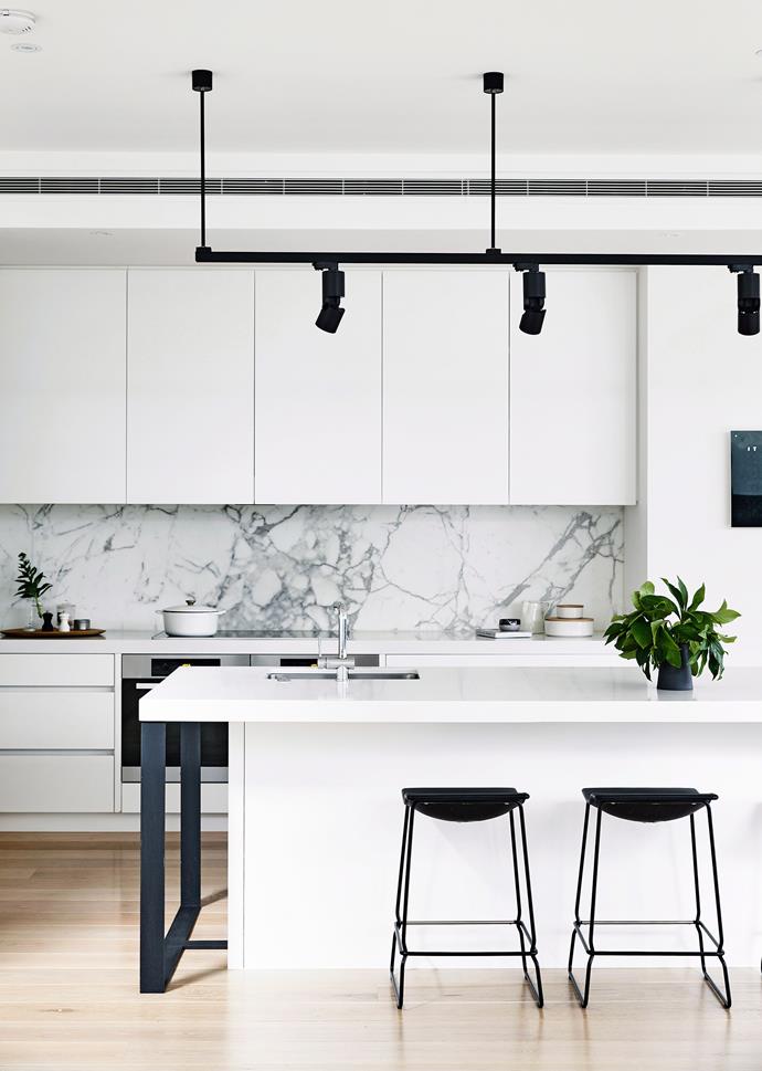 Uptown, a clean monochromatic approach can be relied upon to create a cutting-edge kitchen that is bound to dazzle high society. *Photo: Derek Swalwell / bauersyndication.com.au*