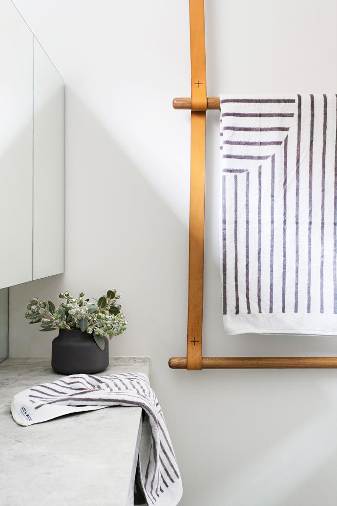 The bespoke joinery continues into the bathroom with the custom-made towel rail by FMD Architects.