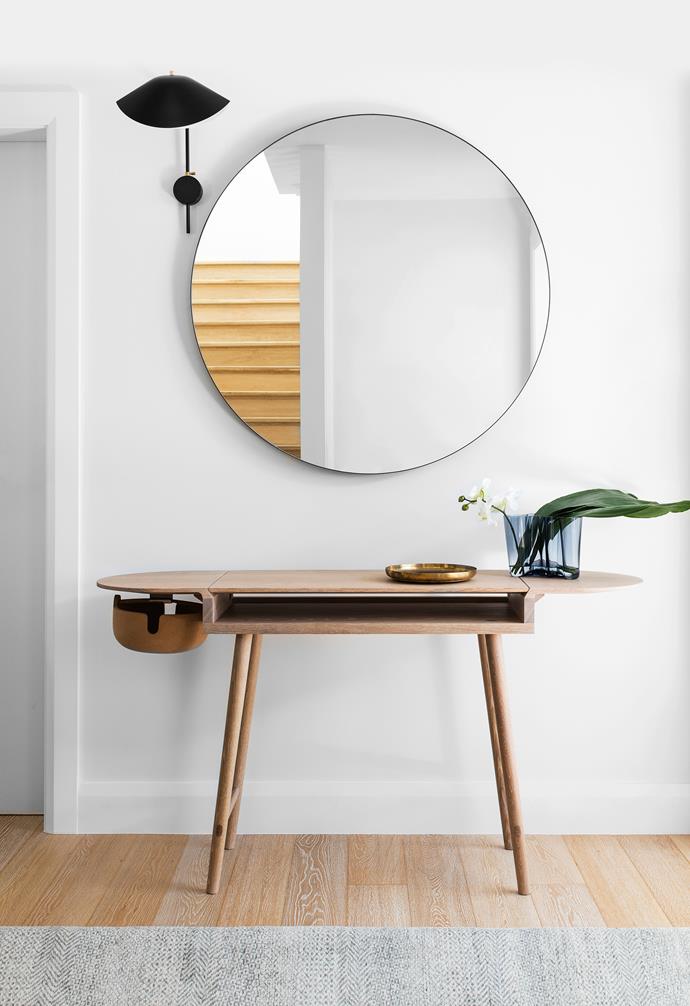 A mirror from Zuster hangs above a Studioilse ‘Companions’ writing desk by De La Espada from [Anibou](http://www.anibou.com.au/). Serge Mouille ‘Antony’ wall light from [Cult](http://www.cultdesign.com.au/).