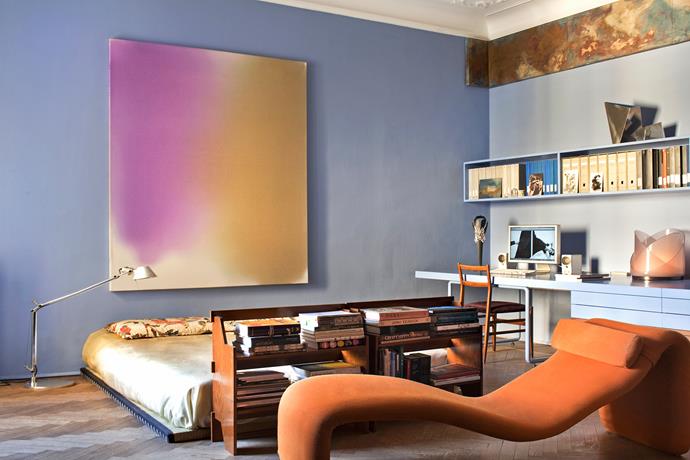 Nathalie has used a small bookcase as a space divider in the large, open bedroom. Above the bed hangs a painting, Ibiza Sunset by Mario Milizia while the bed is covered in a silk cover from Thailand and silk pillowcases from Bali. The 1960s chaise longue is by Olivier Mourgue.