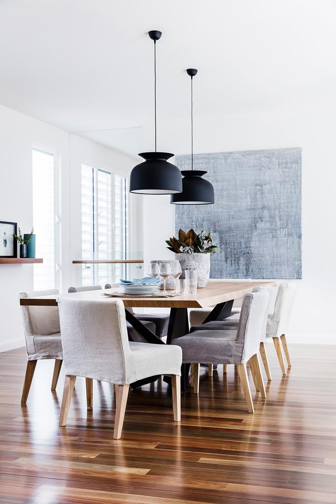 Pale timbers and neutral textiles sit lightly on spotted-gum floors. Skorpio table, [Misura](https://www.misura.com.au/). Chairs and covers, [Bisque Interiors](https://bisqueinteriors.com.au/). Pendant lights, [Cult](http://www.cultdesign.com.au/).