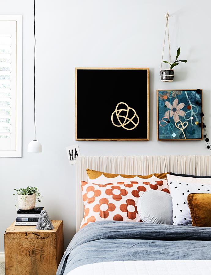 "I like my bedroom to be as simple and quiet as possible. I read novels when I can and they're littered everywhere," Rachel says. She made the bedhead by stretching a silk fabric over a canvas.