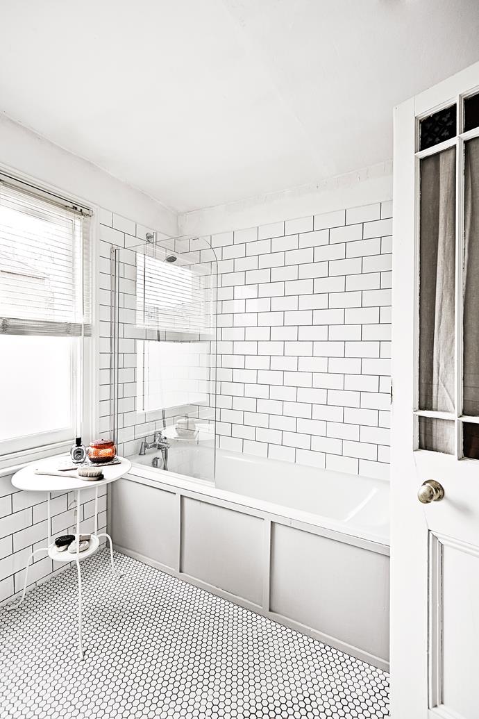 Venetian blinds allow for optimum light while providing privacy in the bathroom. The wall and floor tiles are new additions. The panelling is a clever trick to disguise an old (or ugly) bath.