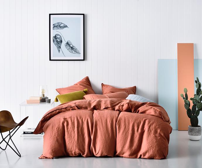 Although perfect for Autumn, when combined with fresh white and pastel blue, layers of terracotta linen add a summertime glow to this contemporary bedroom. Home Republic Vintage Washed Linen in Terracotta, $299.95 from Adairs. Photo: Adairs