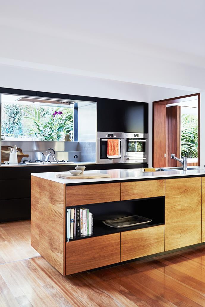 The streamlined kitchen has a few clever hidden features including ceiling speakers and LED lights around the kickboards of the island bench.