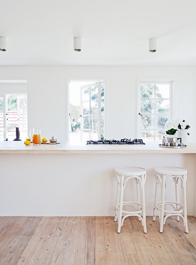 Light timber floorboards add warmth to this [1920s bungalow](https://www.homestolove.com.au/architect-madeline-blanchfields-1920s-sydney-bungalow-4850|target="_blank") that has been refreshed by owner Sydney architect Madeleine Blanchfield, including a white kitchen and white-washed timber floorboards.