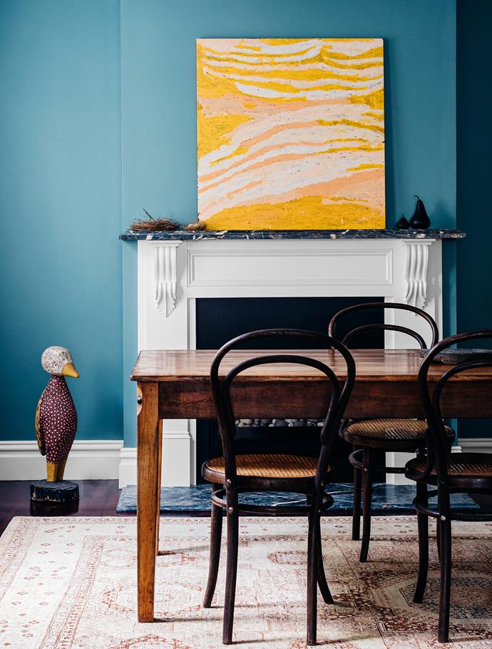 The dining room was left untouched. However its wall colour, chosen by Cecilia several years ago, influenced the palette used in the revamp. For similar wall colour, try Porter's Paints Gun Metal Grey. Table and chairs, [The Shed Newrybar](http://www.theshednewrybar.com/|target="_blank"|rel="nofollow"). Artwork by Makinti Napanangka.