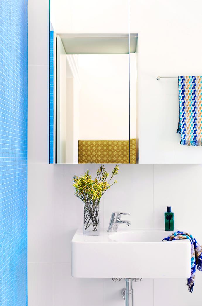 Bright white bathrooms look airy and spacious. Add a few splashes of statement colour for maximum impact. *Photo: Nick Watt / bauersyndication.com.au*