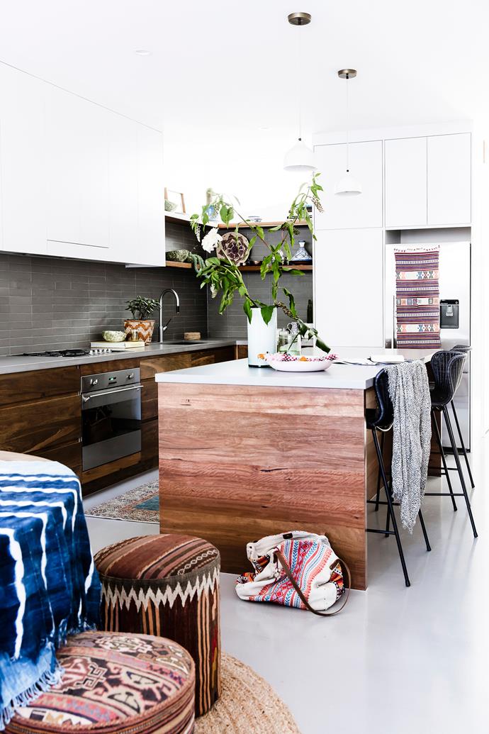 Amelia's husband Thomas built the kitchen using blackbutt timber salvaged during the renovations. The benchtop is Caesarstone and the tiles are from Di Lorenzo.
