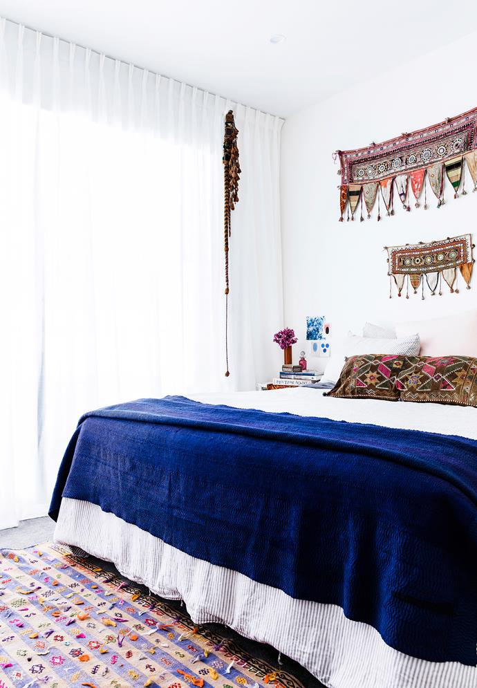 Amelia has brought together gorgeous textiles in her bedroom. The bedlinen is from In Bed, the blue throw was found on a trip to Delihi, India, and the wall hanging is from Gujarat. The hanging ornament is a camel decoration, also from Morocco, and the rug is from Cadrys.