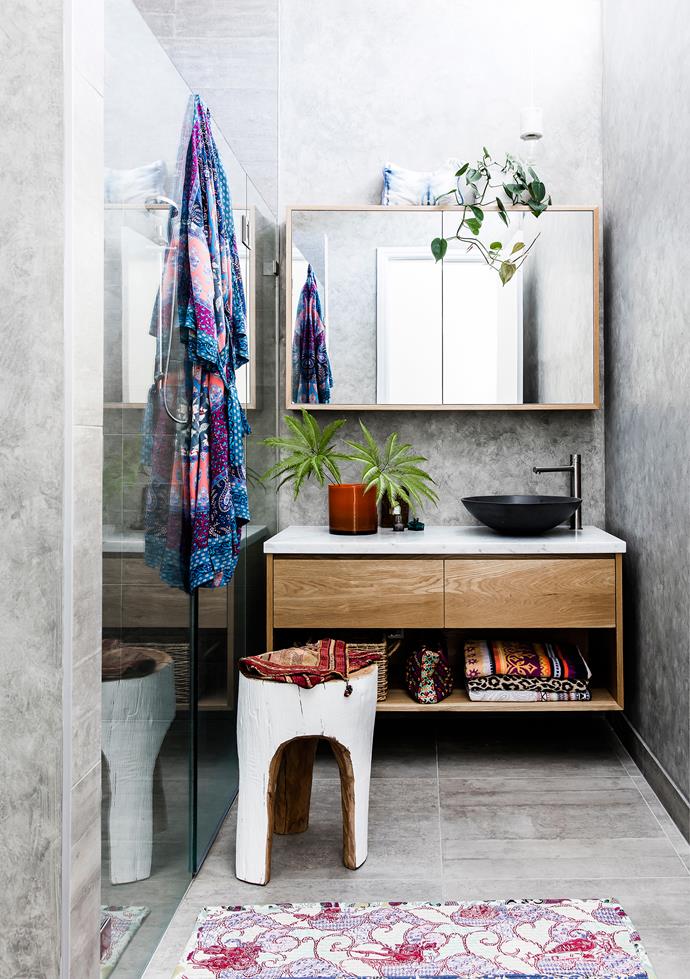 Amelia used a French wash from Porter's Paints to complement the Di Lorenzo tiles in the bathroom. She then layered colour and texture over the greys with a stool from Koskela and vase from Pleine Nature. The towels, bathmat and washbags are all Tigerlily.