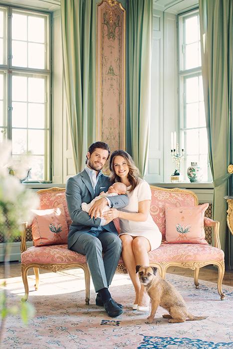 Prince Carl Philip and Princess Sofia of Sweden pose with their newborn son Prince Alexander in one of the the sitting room's in Drottningholm Palace, Sweden. The palatial palace celebrates a pastel palette with hints of gold gilt and luxe furnishings fit for a princess. Photo: Erika Gerdemark / Royal family