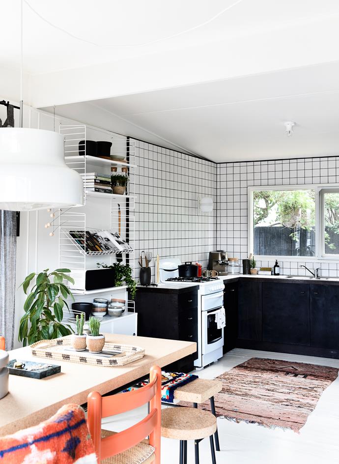 Simone splurged on three things in the kitchen – she tiled to the roofline to help zone the space, and chose a [Santa & Cole](http://www.santacole.com/en/|target="_blank") wall lamp for a beautiful glow, and De’Longhi coffee machine for her morning brew.