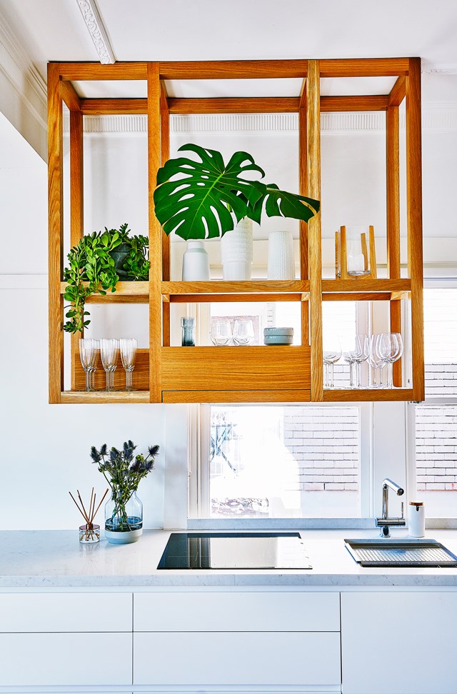 Overhead storage is a functional and stylish option for space-challenged kitchens. Photo: Scott Hawkins / homes+